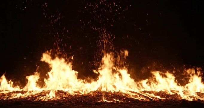 Flames burning in the dark night.