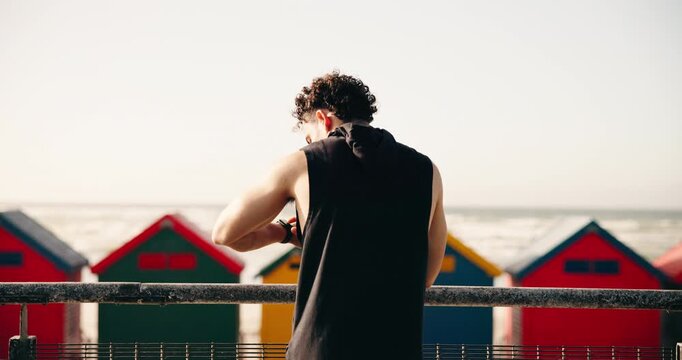 Smart watch, outdoor and man with back, fitness performance and digital app to track progress. View, runner or person with training, exercise or cardio workout with challenge, monitor time or results