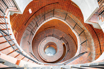 Obraz premium Old spiral staircase in the brick tower