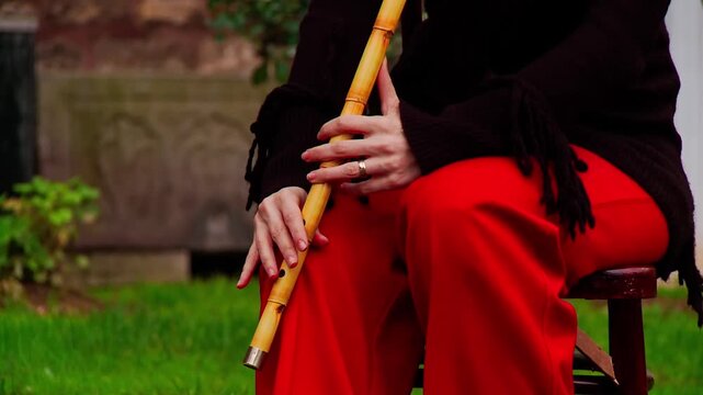 Close Up of Female Hands Playing Traditional Reed Flute Ney