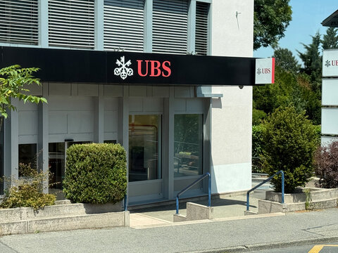Geneva, switzerland - June 20 2025: Exterior view of a Ubs branch office on a sunny day. The sign with the logo is prominently displayed above the entrance.