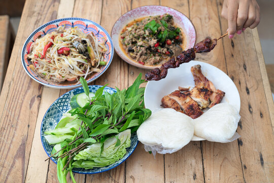 Authentic Thai Isan Food Set Som Tum Papaya Salad, Beef Larb, Grilled Chicken and Sticky Rice