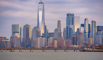 Manhattan skyscrapers reflecting a blue sky. NYC skyscrapers along the waterfront. New York skyline...