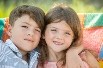 Brother sister hugging with happy smiles. Brother sister showing love and strong connection....
