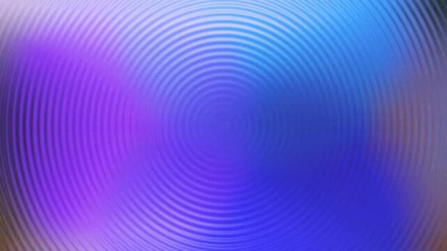 Abstract looping background featuring a colorful radial ripple or wave pattern that pulses and changes color from blue and purple to green and yellow. This footage can be used for VJ loops screen save