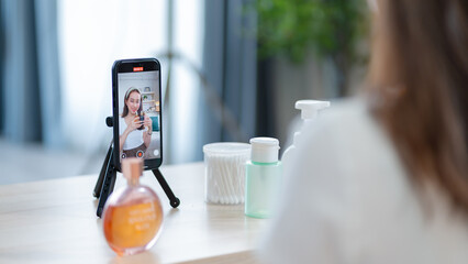 Young attractive two asian woman beauty blogger or vlogger,influencer share story selfie blog skincare vlog.Asia Gen Z influencer vlog apply face skin care make on video shooting and live streaming © Yingyaipumi