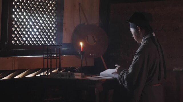Ancient Chinese Scholar Studying by Candlelight at Night，Traditional Chinese Calligraphy and Study in Historical Setting，Contemplative Ancient Chinese Scholar Reading and Writing by Candlelight