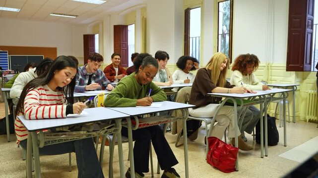 High school students celebrating finishing an exam