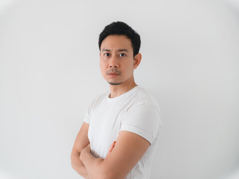 Asian professional with direct gaze and poised posture for profiles