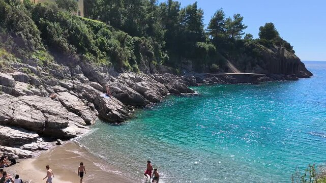 Ieranto Bay beach crowded with tourists on a sunny spring day, a protected FAI paradise in Massa Lubrense, near Naples. One of the world&rsquo;s most beautiful beaches, Italy.