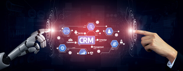 Obraz premium Captivating image showcasing a robotic hand and a human hand reaching towards a digital interface for customer relationship management, symbolizing innovation in business. Tessel