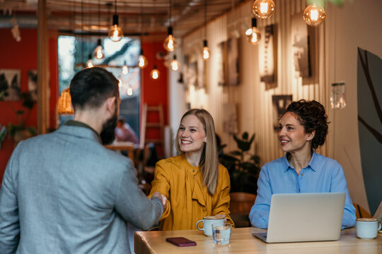 Business people having an informal meeting and handshake