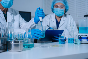 Fototapeta premium Medical test vaccine research and development concept. Scientist in laboratory study and analyze scientific sample of antibody.