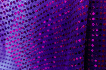 Shimmering Textile with Circular Sequin Pattern in Shades of Purple and Pink