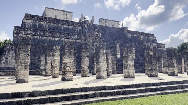 Couple walking at the temple of the warriors in chichen itza, mexico. Chichen itza