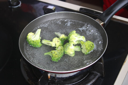 Fresh Broccoli Boiling in Pan Healthy Cooking Concept