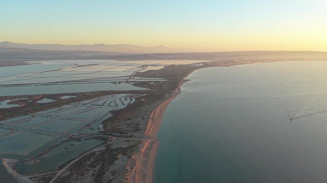 Aerial view of salinas de santa pola salt flats at sunset