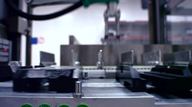 Modern automated factory production line with robotic arms and smart technology for efficient manufacturing.