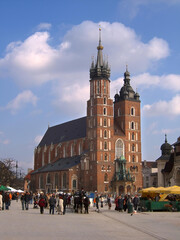 Obraz premium St. Mary's Basilica, located in Krakow's Main Market Square, is one of the most recognizable monuments in Poland, an outstanding example of Gothic brick architecture.