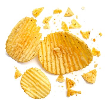 A close-up of broken potato chips on a white background