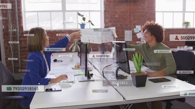 Woman reaching doc, man touching, returning to keys, animated overlays on doc aiding tech review