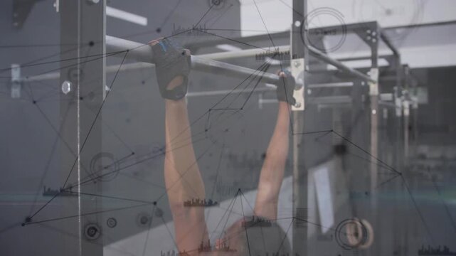 Woman gripping pull-up bar and pulling upward in gym, overlays tracking joint motion for fitness