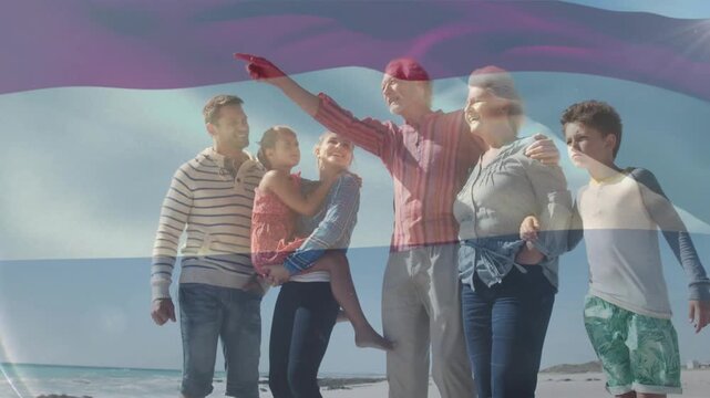 Family standing shore senior pointing cueing group turning to sea flag drifting over group design