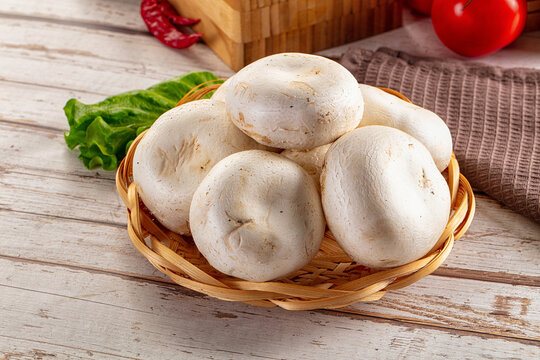 Raw white champignon mush heap