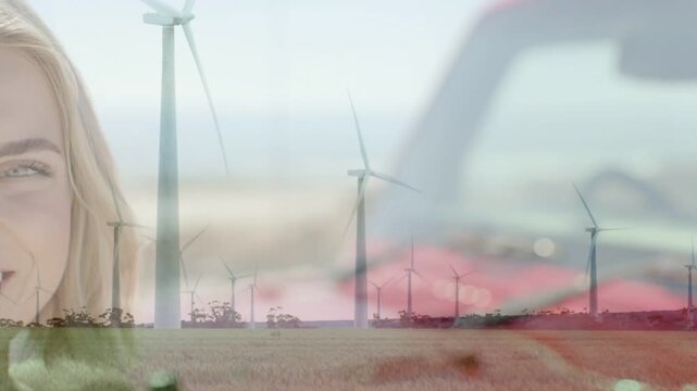 Woman smiling while portrait shifting causing turbine spinning and car frame moving for renewables