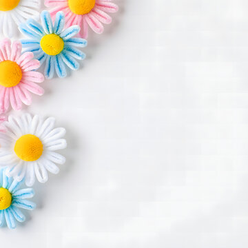 Colorful Pastel Handmade Pipe Cleaner Daisy Corner Frame on White Background with Copy Space