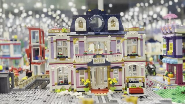 Miniature toy hotel building in model city diorama