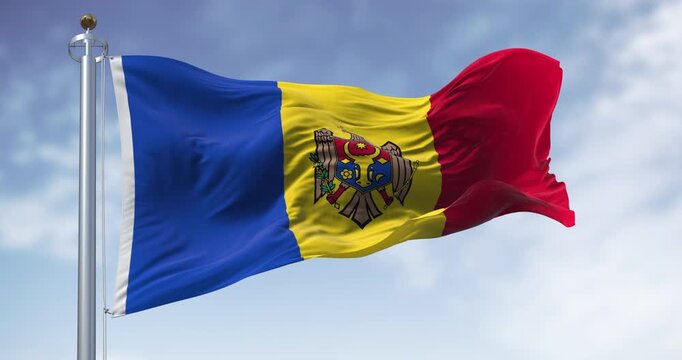 Moldova national flag waving on a clear day. vertical tricolor of blue, yellow, and red with the national coat of arms in the center. Seamless 3d render animation. Slow motion loop. Selective focus