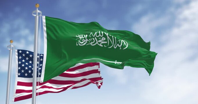 Saudi Arabia and United States flags waving side by side. International identity, patriotism, and cultural unity between East and West. Seamless 3d render animation. Slow motion loop. Selective focus