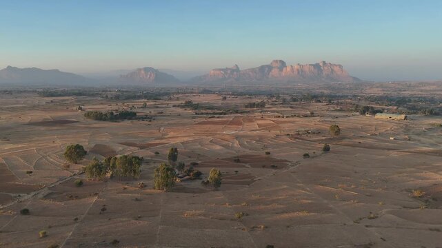 Drone view of the Gheralta range in northern Ethiopia, with cliffs and plateaus stretching across Tigray, wide aerial footage.