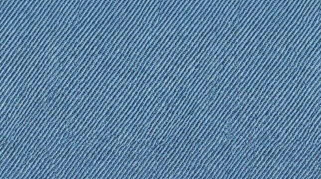 Closeup of light blue denim fabric with a diagonal weave pattern