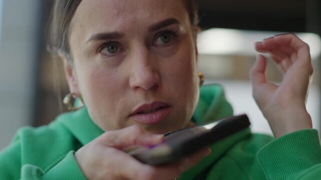 Concerned Woman Records a Voice Message on Her Smartphone