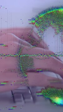 Adult hands typing on keyboard at desk with glitch particles swirling near pink sleeve