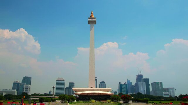 Jakarta, Indonesia - April 2, 2026: Timelapse of Monas or National Monument standing with clear sky. National Monument is Jakarta's famous landmark.