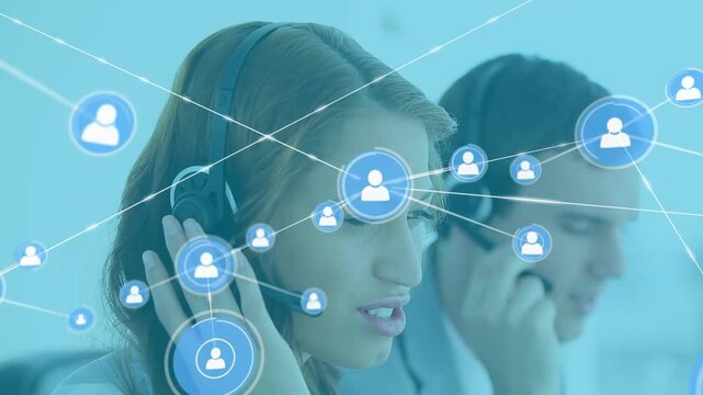 Call center agents talking on their headsets in their office