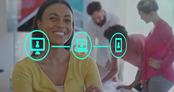 Animation of flowchart of icons over smiling woman standing arms crossed in office