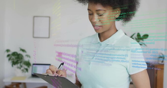 Office professional writing notes while code overlays guiding tech analysis with smiling confidence