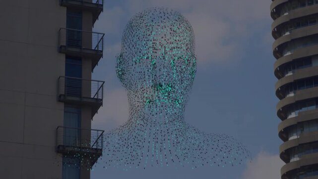 Suspended pointcloud tech artwork forming between towers green core glowing revealing facial detail