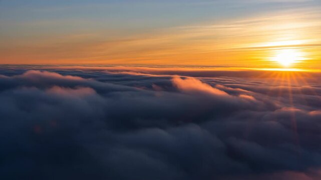 Sunset aerial view with clouds and orange sky at dusk featuring sunrise, cloudscape, atmosphere with nature and landscape elements for scenic,