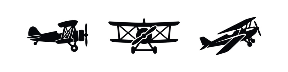 Set of three black vintage biplane silhouettes on a white background, featuring front, side, and perspective views of classic propeller aircraft. © Lili