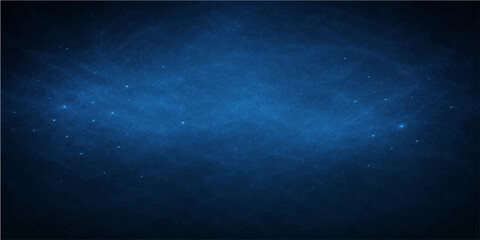 Abstract deep blue background resembling a starry night sky, with subtle textures and gentle gradients creating a sense of depth and mystery. The image is evocative of boundless space. © DAKU MOHARAJ