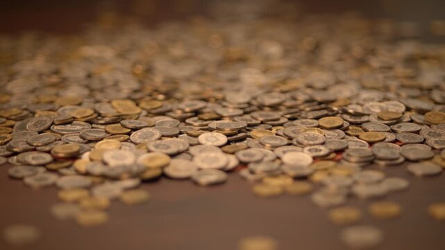 hand holding coin savings in slow motion. Money cash coins concept background