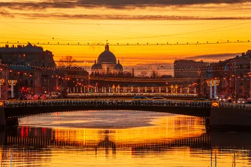 Fototapeten Orange View of the Fontanka River and the Trinity-Izmailovsky Cathedral. Festive illumination.  © lizavetta