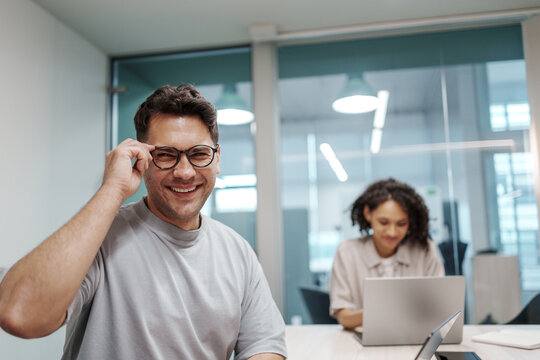 Expert Meticulously Assessing Spreadsheet Metrics With Colleague Present In Calm Work Environment