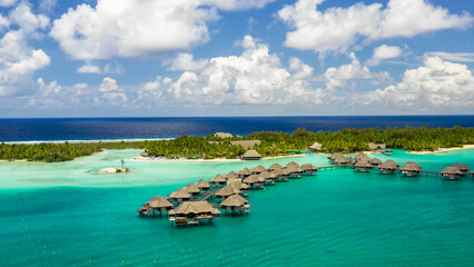 Aerial View of Luxury Overwater Bungalow Resort in Tropical Turquoise Lagoon, French Polynesia © SoftArt