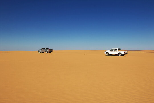 Chinguetti, Mauritania - 11 Jan 2022: Cars on sand dunes of Sahara Desert , Mauritania, West Africa